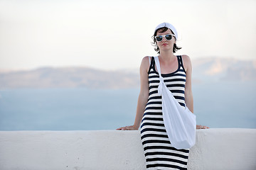 Image showing Greek woman on the streets of Oia, Santorini, Greece