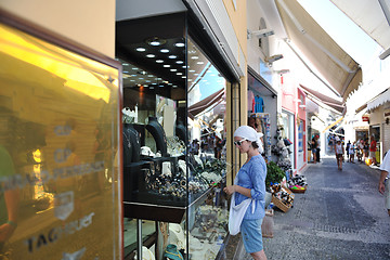 Image showing Greek woman on the streets of Oia, Santorini, Greece