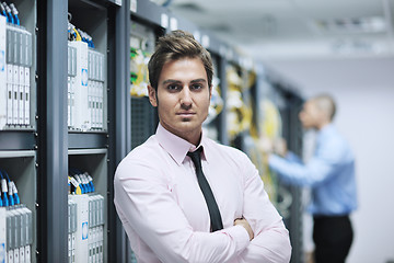 Image showing it enineers in network server room