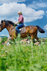 Image showing happy woman  ride  horse