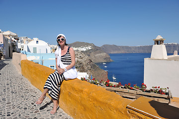 Image showing Greek woman on the streets of Oia, Santorini, Greece