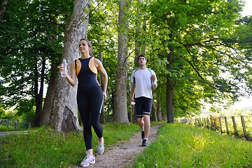 Image showing Young couple jogging