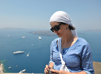 Image showing Greek woman on the streets of Oia, Santorini, Greece