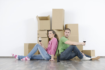 Image showing Young couple moving in new home