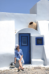 Image showing Greek woman on the streets of Oia, Santorini, Greece