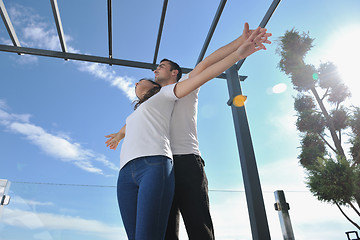 Image showing couple relaxing on balcony