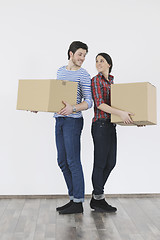 Image showing Young couple moving in new home