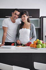 Image showing young couple have fun in modern kitchen