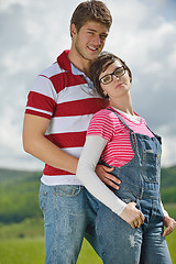 Image showing Portrait of romantic young couple smiling together outdoor