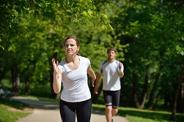 Image showing Young couple jogging at morning