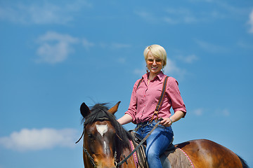 Image showing happy woman  ride  horse