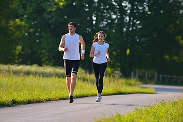 Image showing Young couple jogging