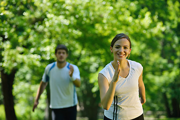 Image showing Young couple jogging at morning