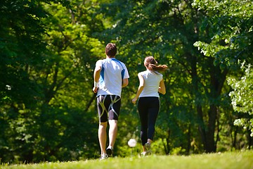 Image showing Young couple jogging