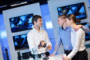 Image showing Young couple in consumer electronics store