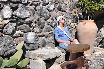 Image showing Greek woman on the streets of Oia, Santorini, Greece