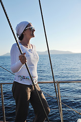 Image showing Greek woman on the streets of Oia, Santorini, Greece