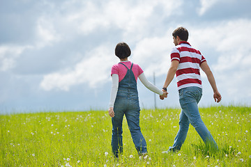 Image showing Portrait of romantic young couple smiling together outdoor