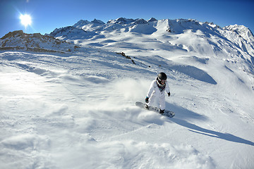 Image showing skiing on fresh snow at winter season at beautiful sunny day