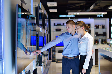 Image showing Young couple in consumer electronics store