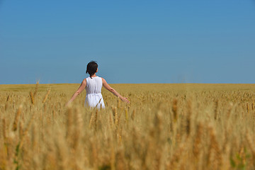 Image showing young woman in wheat field at summer