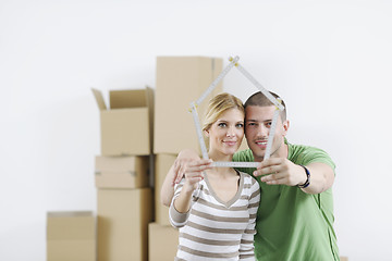 Image showing Young couple moving in new home