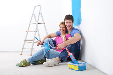 Image showing happy young cople relaxing after painting in new home