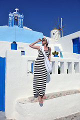 Image showing Greek woman on the streets of Oia, Santorini, Greece