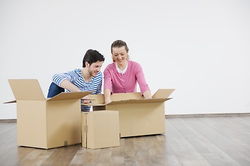 Image showing Young couple moving in new home