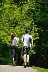 Image showing Young couple jogging