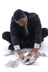 Image showing Business man holding money