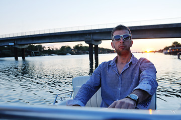 Image showing portrait of happy young man on boat