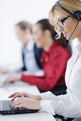 Image showing business woman group with headphones