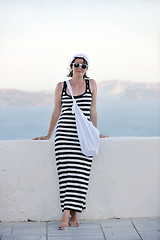 Image showing Greek woman on the streets of Oia, Santorini, Greece