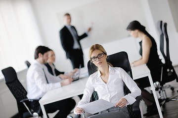 Image showing business woman with her staff in background