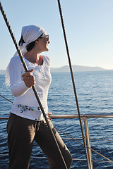 Image showing Greek woman on the streets of Oia, Santorini, Greece