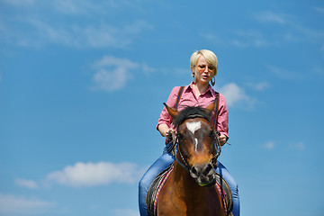 Image showing happy woman  on  horse