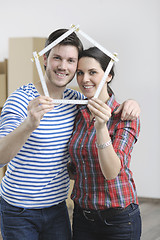 Image showing Young couple moving in new home