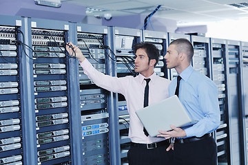 Image showing it enineers in network server room