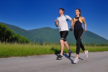 Image showing Young couple jogging