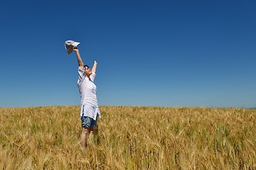 Image showing young woman in wheat field at summer