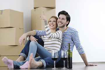 Image showing Young couple moving in new home