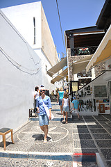 Image showing Greek woman on the streets of Oia, Santorini, Greece