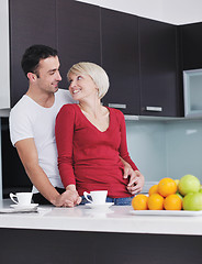 Image showing young couple have fun in modern kitchen