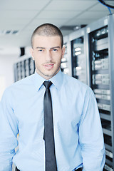 Image showing young it engeneer in datacenter server room