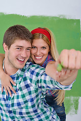 Image showing happy couple paint wall at new home