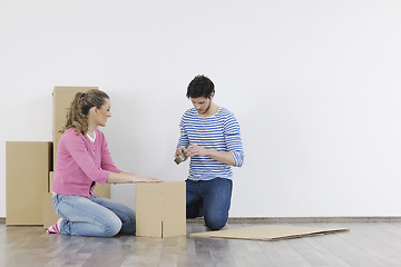 Image showing Young couple moving in new home