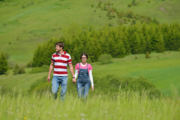 Image showing Portrait of romantic young couple smiling together outdoor