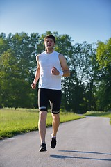 Image showing Young couple jogging at morning