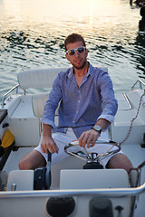 Image showing portrait of happy young man on boat